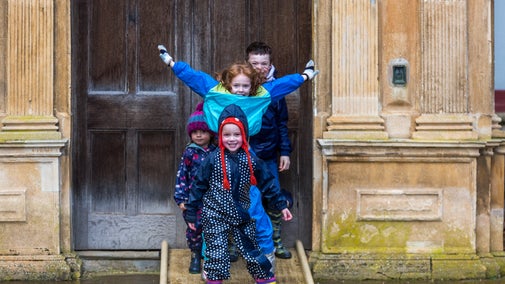 Children in front of the House at Charlecote in winter